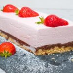 Can You Decorate a Cake With Cream Cheese Frosting Freshly baked cake with smooth and creamy cream cheese frosting, perfectly decorated with swirls and designs