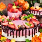 Colorful assortment of intricately decorated cakes in celebration of National Cake Decorating Day