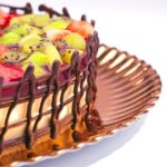 Vibrant buttercream decorations elevate the charm of cakes, creating irresistible eye-catching designs