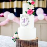 A Cake Decorator Roll a Piece A skilled cake decorator expertly rolls a piece of fondant for decoration