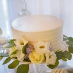 Fruit cake with a festive decoration featuring various fruits and berries