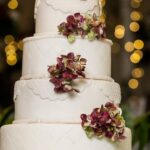 Freshly baked cake adorned with an assortment of vibrant and luscious fruits