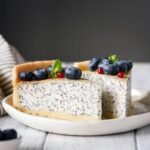 Frozen-themed cake decorations, including snowflake toppers and character figurines for a magical winter celebration