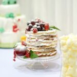 Buttercream Cake Decorating Delicious buttercream cake decorating with intricate piping and vibrant floral designs