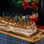 Decorating an Easter Cake Easter-themed cake with pastel-colored decorations and a bunny-shaped cake topper