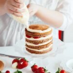 Step-by-step guide on how to decorate a cake with buttercream icing for a delightful finish
