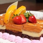 Step-by-step guide on sticking fondant decorations to a cake with expert tips