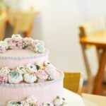 Decorate Cake With Icing Illustration of hands decorating a cake with icing in various colors
