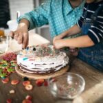 How to Decorate Red Velvet Cake Slices of a beautifully decorated red velvet cake with cream cheese frosting