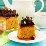 Decorate a Fruit Cake Colorfully decorated fruit cake with vibrant icing, fruits, and a beautiful design