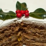 Decorated angel food cake with fresh strawberries and whipped cream for a simple, elegant dessert