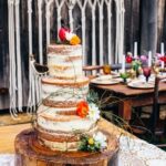 Step-by-step guide on how to decorate a cake with pineapple slices and fondant flowers