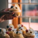 Step-by-step guide on how to decorate a cake with fresh and edible flowers for a stunning presentation