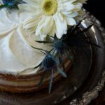 Step-by-step guide on how to decorate side of cake with colorful sprinkles for a stunning finish