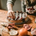 Angel food cake decorated with colorful frosting and sprinkles for a birthday celebration