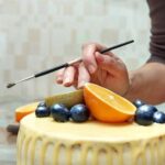 How to Decorate a Red Velvet Birthday Cake Step-by-step guide on how to decorate a luscious red velvet birthday cake with cream cheese frosting