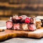 Decorate cake with fresh orange slices for a zesty and colorful presentation