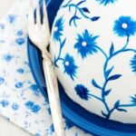 How to Decorate a Spice Cake Step-by-step guide on how to decorate a spice cake with icing swirls and edible flowers