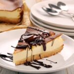 Step-by-step guide on how to decorate a pink cake with colorful frosting and edible flowers