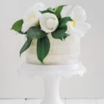 How to Decorate Almond Cake Step-by-step guide on how to decorate almond cake with icing and sliced almonds