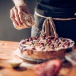 What to Decorate Carrot Cake With What to decorate carrot cake with: cream cheese frosting, walnuts, and edible flowers