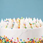 Step-by-step guide on how to decorate a cake with frosting tips for a professional finish