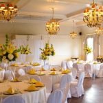 Do You Wear Engagement Ring on Wedding Day Engaged bride wearing engagement ring walking down aisle on wedding day