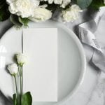 Light tailored suit, linen shirt, and boat shoes