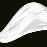 Close-up photo of hands intertwined, focus on 'Which hand is the wedding finger' with ring