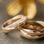 Wedding ring on left hand. Symbolizes love and commitment