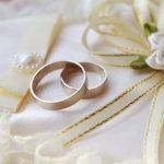 What to Wear to a Country Wedding flowy sundress, cowboy boots, straw hat, and a charming smile