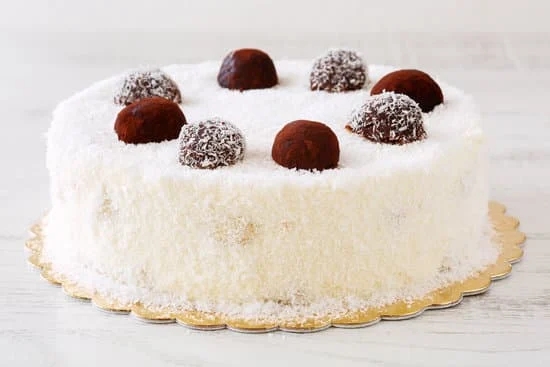 Decorate a beer bottle cake with fondant and edible prints for a fun celebration