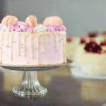 How to decorate a 3-tiered heart-shaped Bundt cake with vibrant frosting and sprinkles