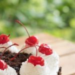 Create visually appealing cake by decorating with fresh lemon slices for a vibrant touch