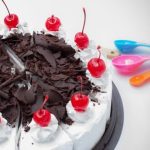 Step-by-step guide on how to frost and decorate a stacked cake like a pro